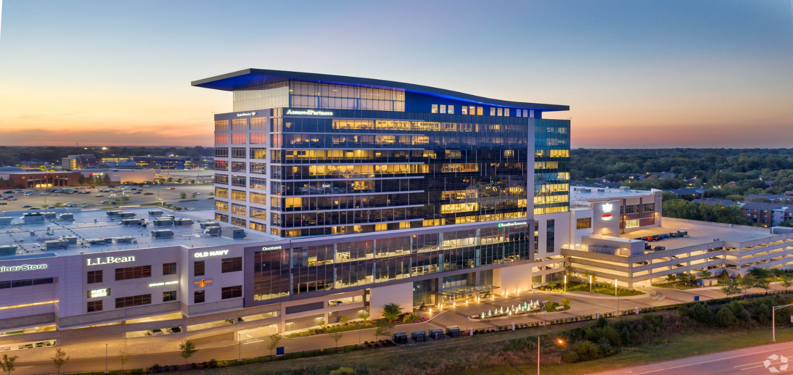 Kenwood Towne Place office tower and retail at dusk